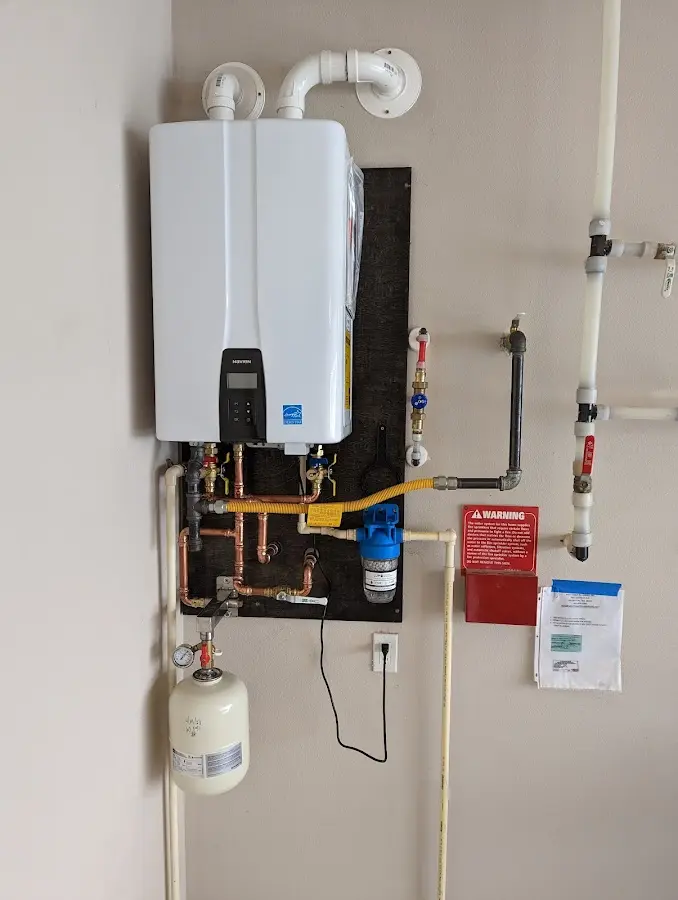 Professional plumber installing copper piping in a Riviera Beach home